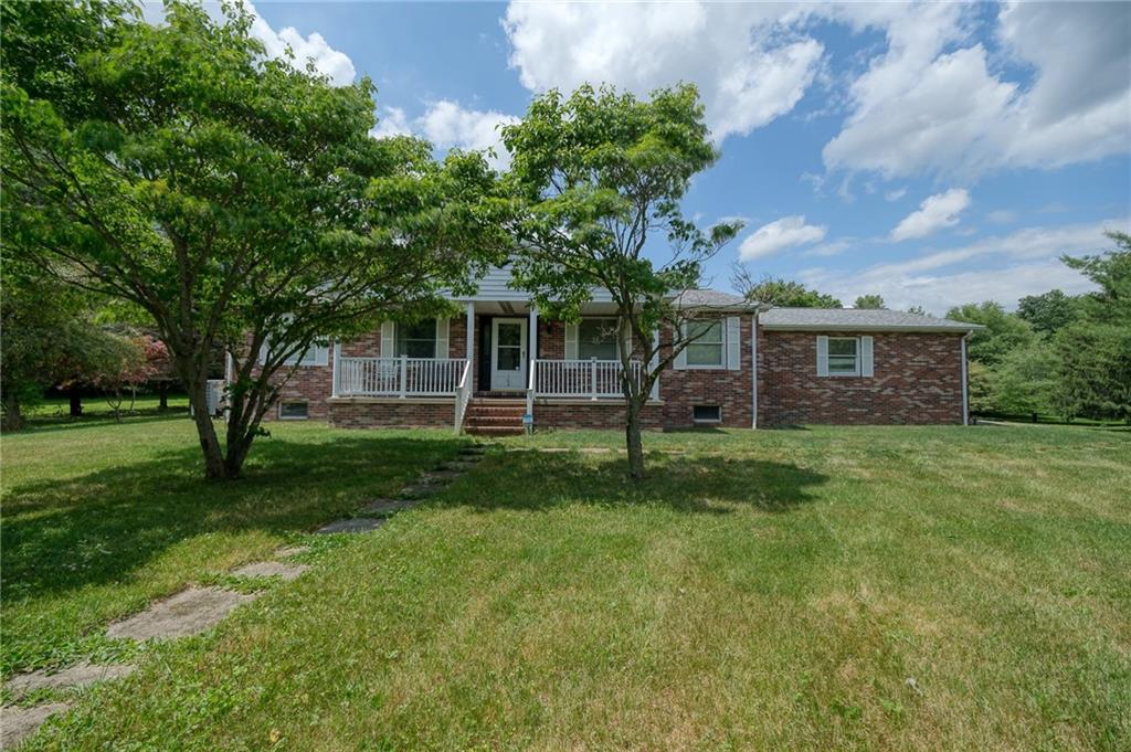 704 Unionville Road Prospect, PA 16052 - Photo 1 of 25 a view of a house with a backyard