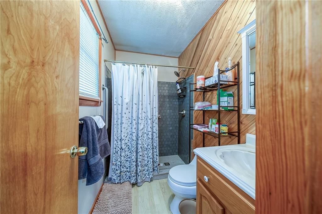 704 Unionville Road Prospect, PA 16052 - Photo 12 of 25 a room with blue walls and door