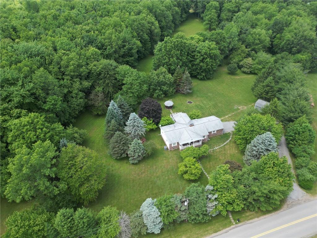 704 Unionville Road Prospect, PA 16052 - Photo 22 of 25 a backyard of a house with lots of green space