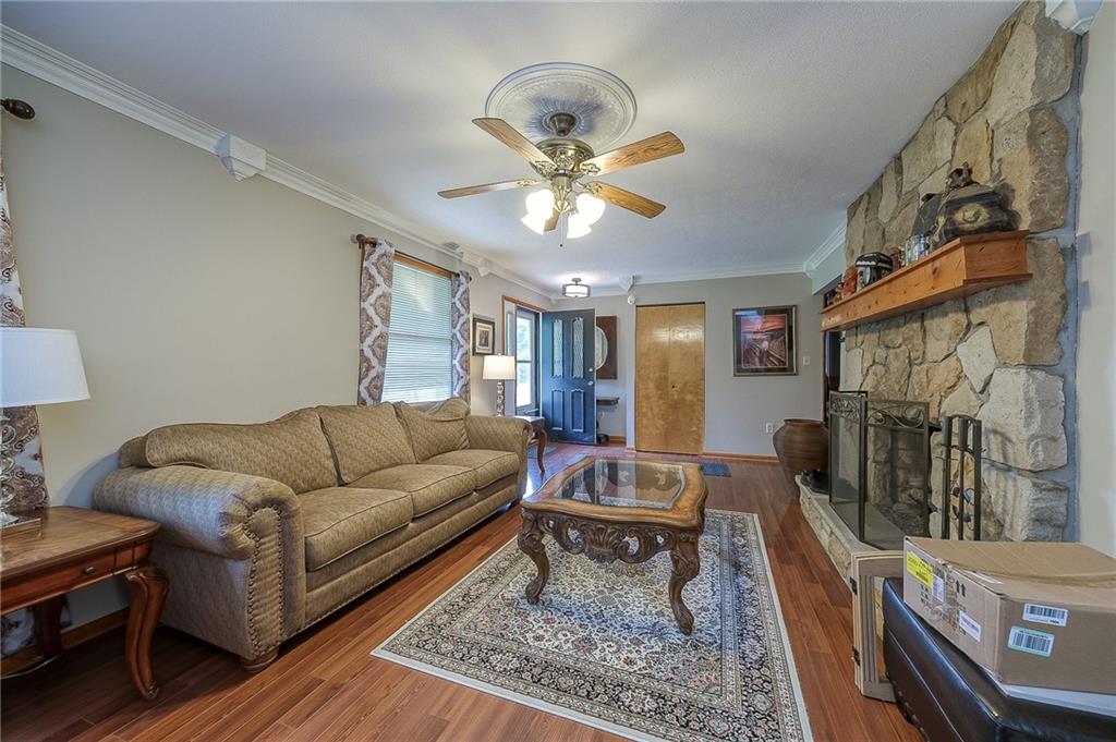 704 Unionville Road Prospect, PA 16052 - Photo 3 of 25 a living room with furniture and a rug