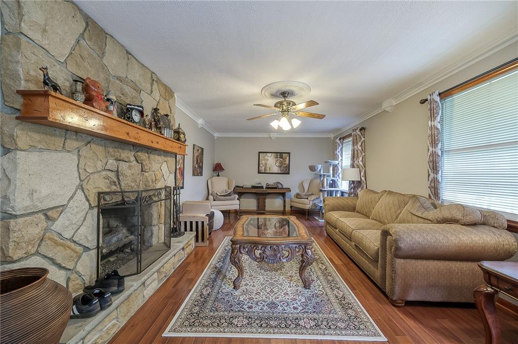 704 Unionville Road Prospect, PA 16052 - Photo 4 of 25 a living room with furniture and a fireplace