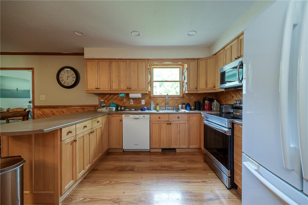 704 Unionville Road Prospect, PA 16052 - Photo 5 of 25 a kitchen with sink cabinets and window