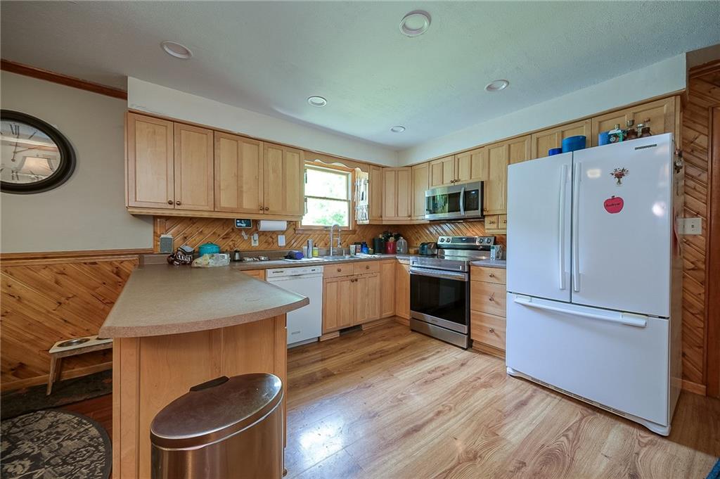 704 Unionville Road Prospect, PA 16052 - Photo 6 of 25 a kitchen with granite countertop a refrigerator stove top oven and sink
