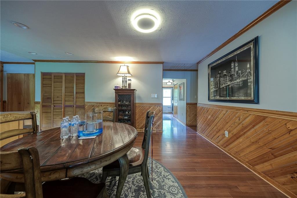 704 Unionville Road Prospect, PA 16052 - Photo 7 of 25 a dining room with furniture and wooden floor