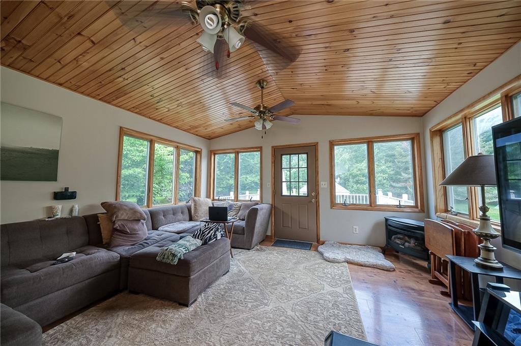 704 Unionville Road Prospect, PA 16052 - Photo 9 of 25 a living room with furniture tv and a large window