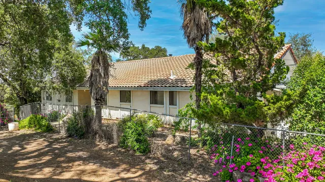 a view of a balcony with wooden floor