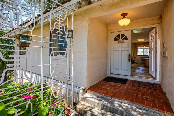 a view of a balcony with wooden floor