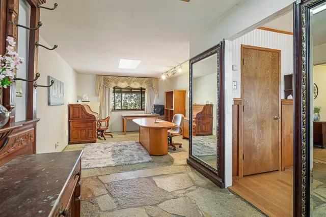 a living room with furniture and a window