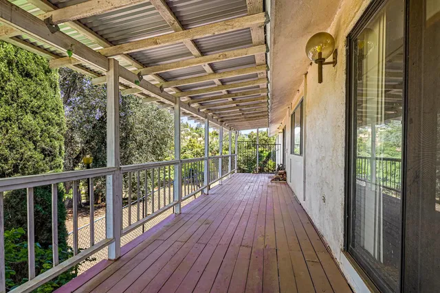 a view of a house with a yard and roof