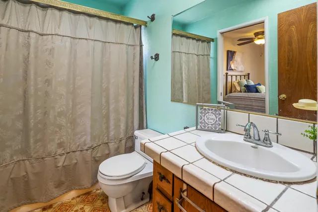 a view of a lawn chair and tables in the patio