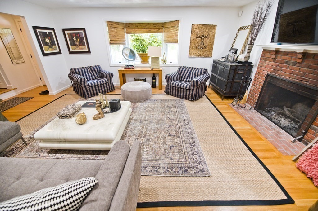 16 Warren Avenue Newton, MA 02465 - Photo 35 of 42 a living room with furniture fireplace and flat screen tv