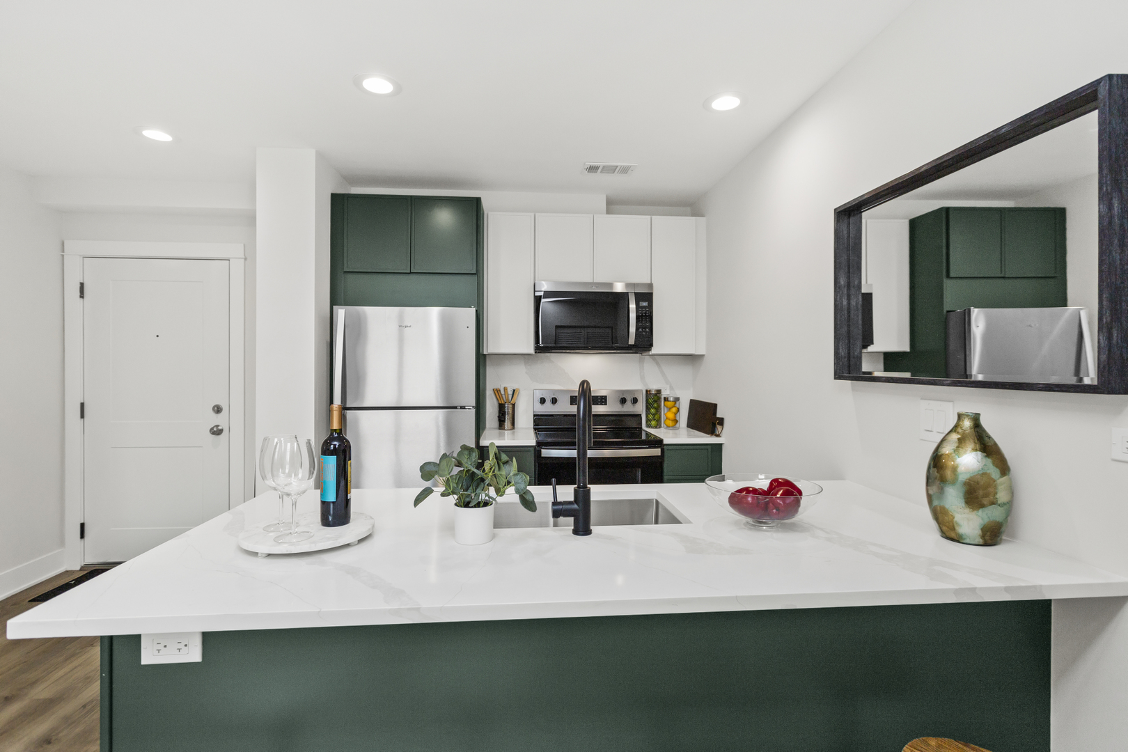 1453 Maple Avenue, Unit 107 Evanston, IL 60201 - Photo 6 of 21 a kitchen with a sink cabinets and appliances
