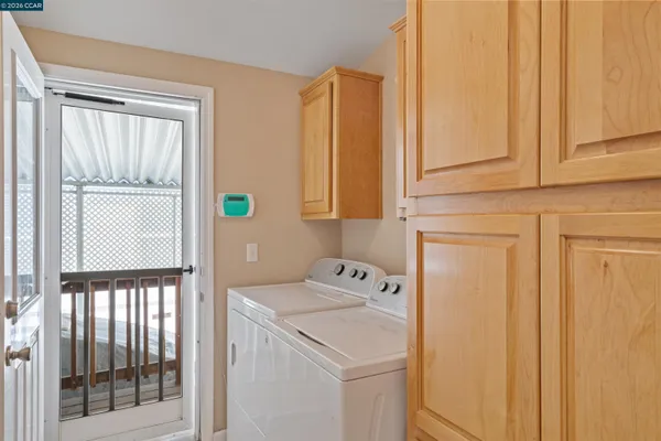 a utility room with dryer and washer