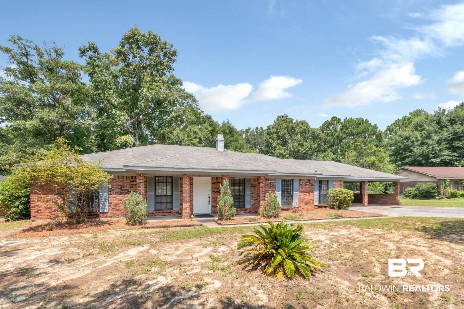 5812 Fern Valley Road Mobile, AL 36609 - Photo 29 of 32 Brick exterior with a covered front porch and a paved driveway