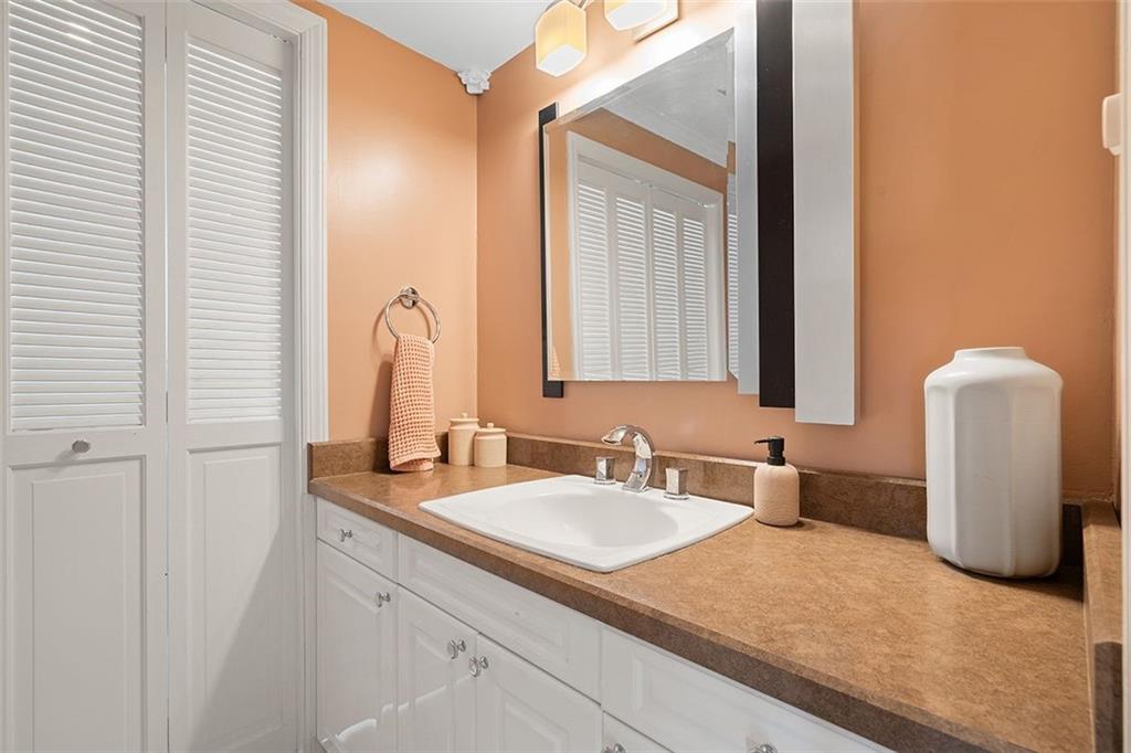 2121 Magnolia Street Pittsburgh, PA 15212 - Photo 16 of 36 a bathroom with a sink and a mirror