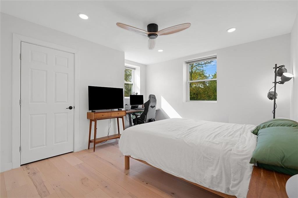 2121 Magnolia Street Pittsburgh, PA 15212 - Photo 18 of 36 a bedroom with a bed and a flat screen tv