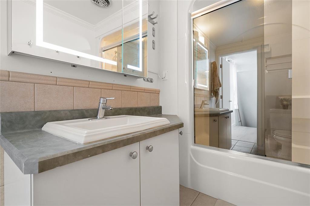2121 Magnolia Street Pittsburgh, PA 15212 - Photo 23 of 36 a bathroom with a sink and a mirror