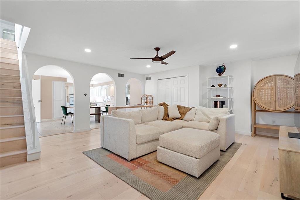 2121 Magnolia Street Pittsburgh, PA 15212 - Photo 3 of 36 a living room with furniture a clock and a ceiling fan