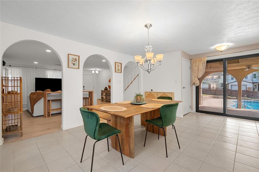 2121 Magnolia Street Pittsburgh, PA 15212 - Photo 7 of 36 a view of a dining room with furniture and a chandelier