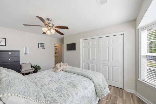a bedroom with a bed and a window