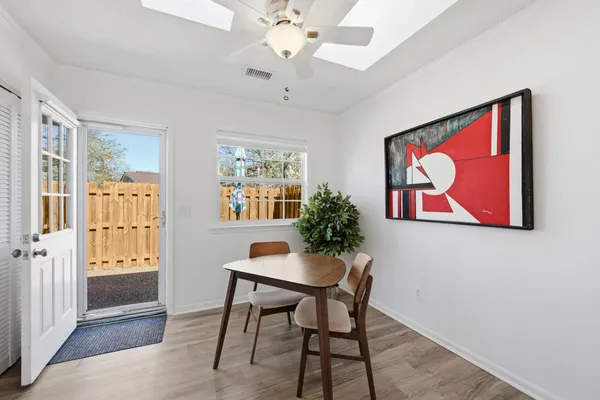 a dining room with furniture and window