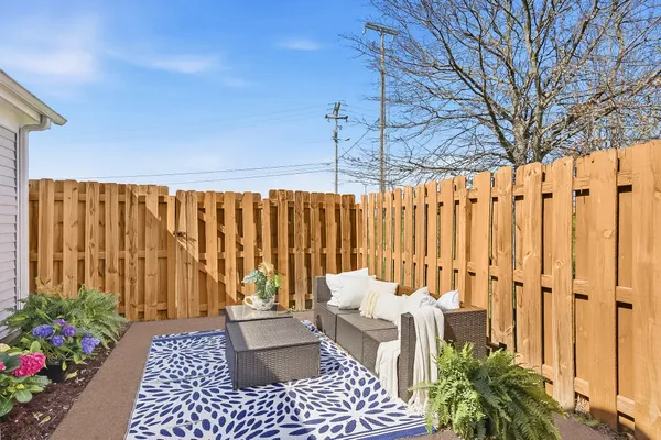 a backyard of a house with outdoor seating