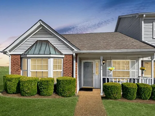 a front view of a house with a yard