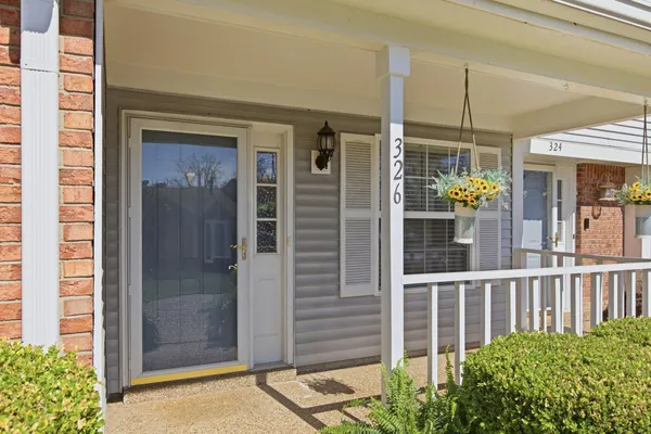 a view of a house with a door and wooden floor