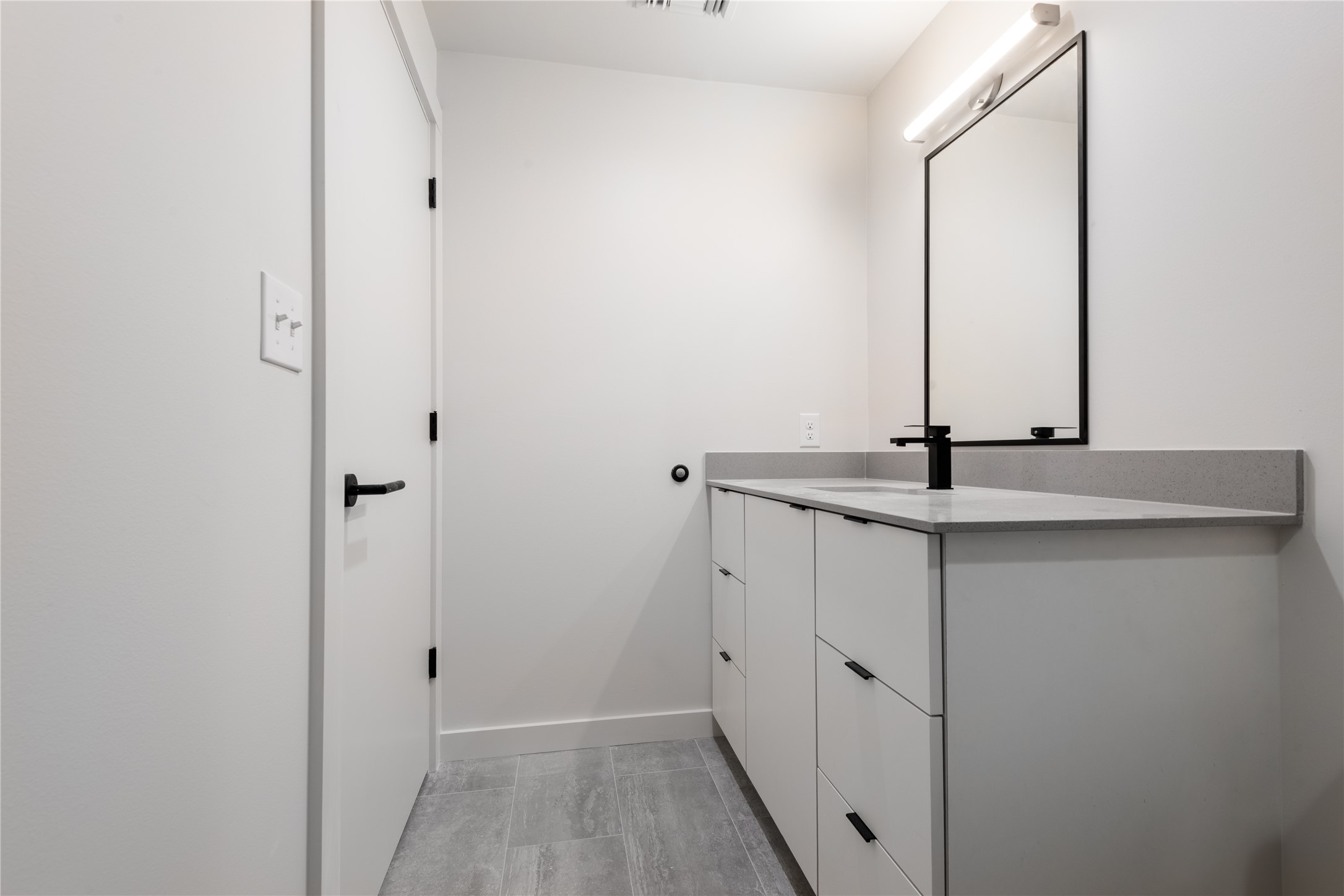 3515 Webberville Road, Unit VISTA Austin, TX 78702 - Photo 10 of 22 a bathroom with a sink and a mirror
