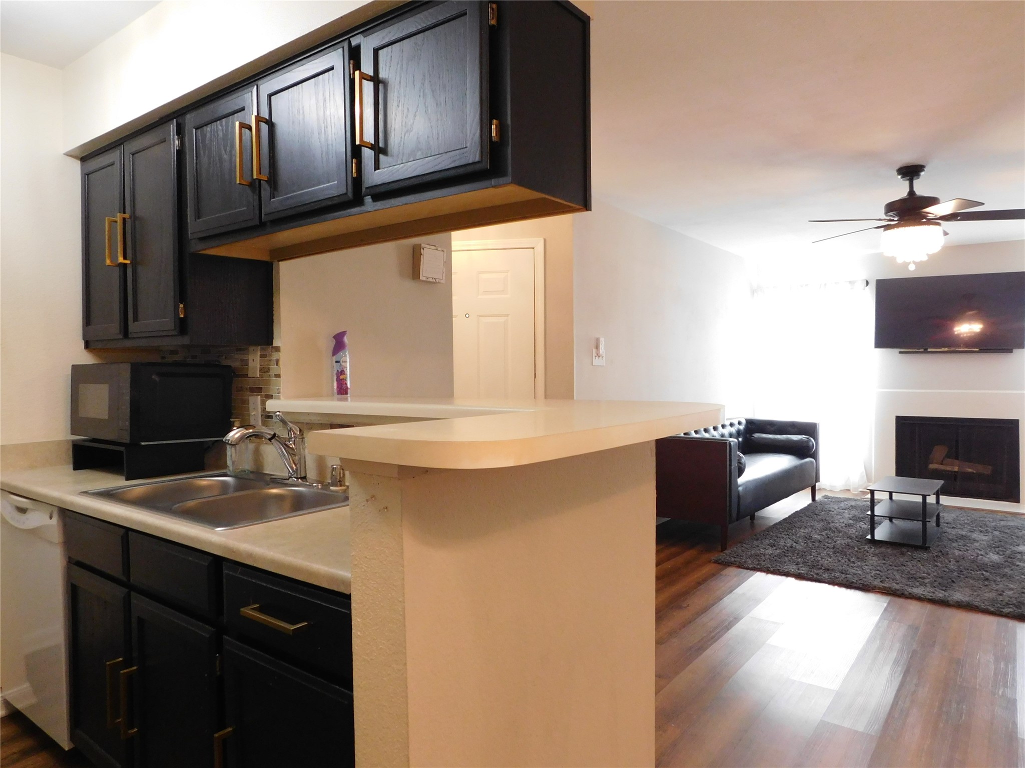 10101 South Gessner Road, Unit 912 Houston, TX 77071 - Photo 16 of 47 a kitchen with stainless steel appliances granite countertop a sink dishwasher stove and cabinets