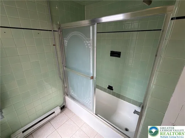 a bathroom with a shower and a toilet