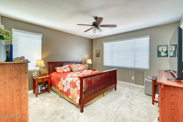 a bed room with a bed and a window