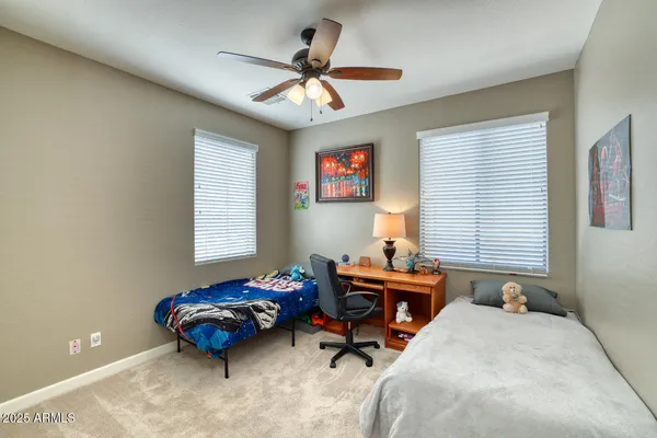 a bedroom with furniture and windows