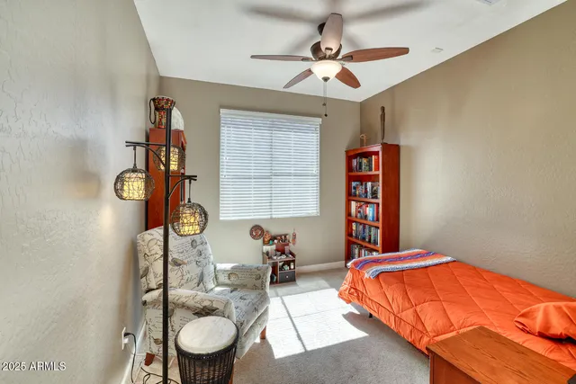 a bedroom with bed and a window