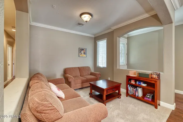 a bedroom with furniture and a window