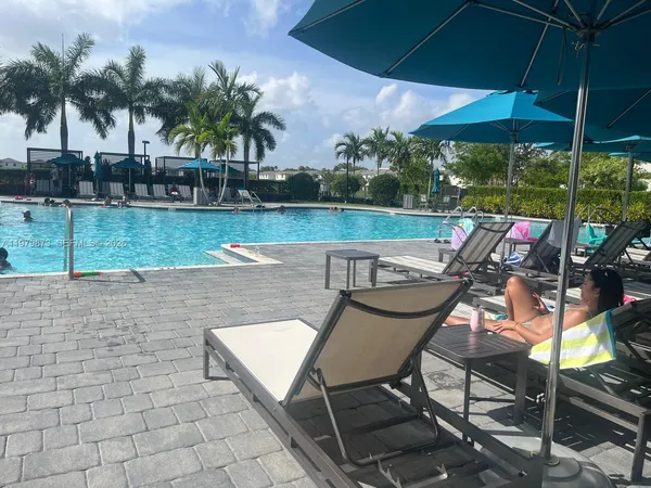 a view of a chairs and table in an outdoor space