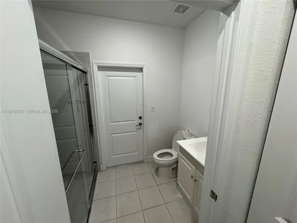a bathroom with a sink and toilet