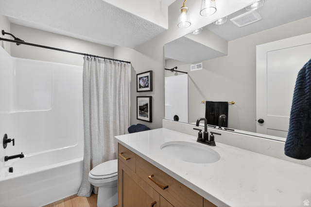 2841 West 2705 North, Unit 69 Ogden, UT 84404 - Photo 30 of 31 Bathroom featuring a white bathtub and shower combination with matte black fixtures