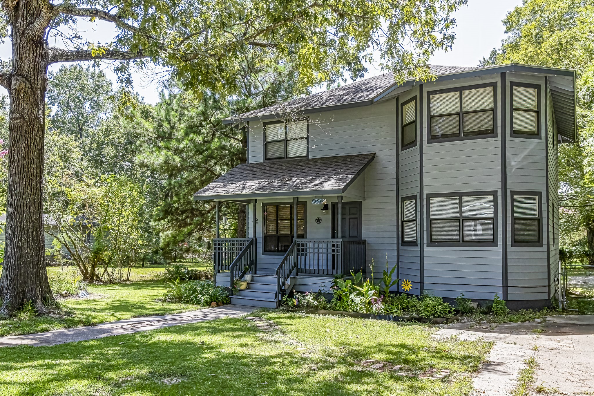 front view of a house with a yard