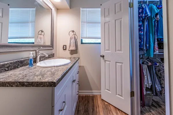 a bathroom with sinks granite countertop a sink and a mirror