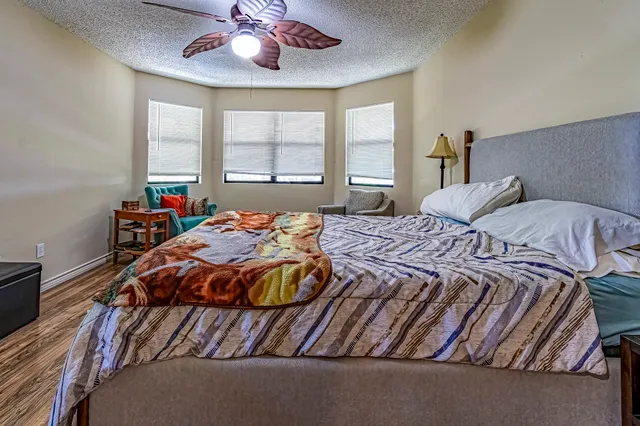 a bedroom with a bed and window