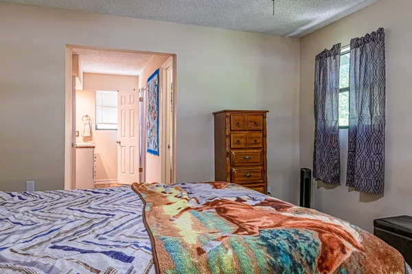 a bedroom with a bed and a closet