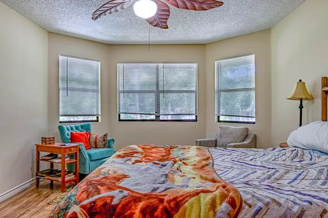 a bedroom with bed and a window