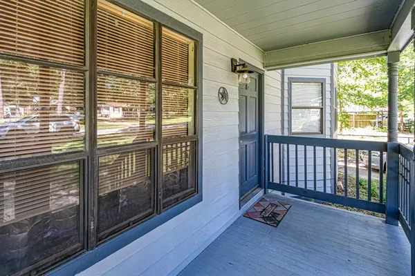 a view of an empty room and wooden floor