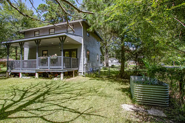 a small house with a trees in the background