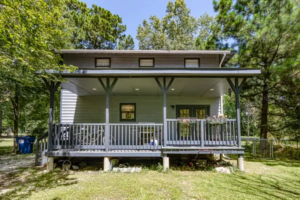 a view of a deck with barbeque grill and wooden deck