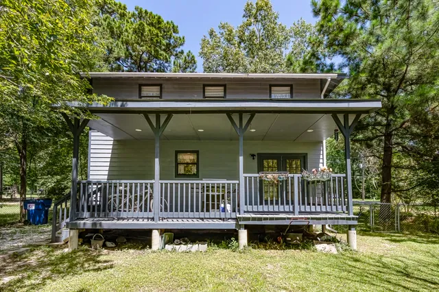 a view of a deck with barbeque grill and wooden deck