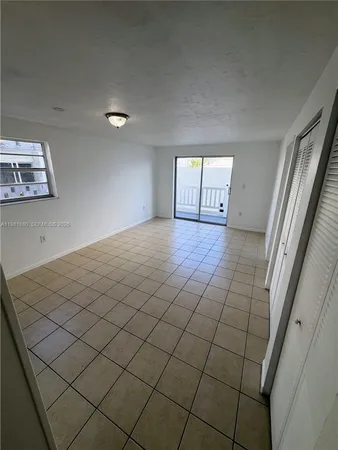 a view of a livingroom and window