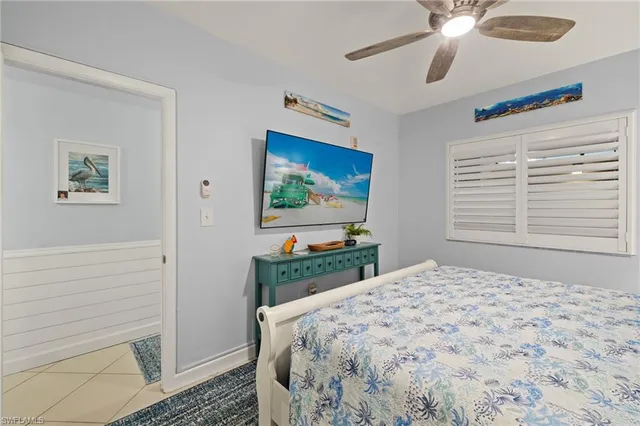 a bathroom with a sink mirror toilet and bathtub