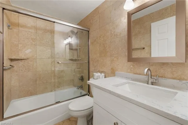 a view of a bedroom with washer and dryer